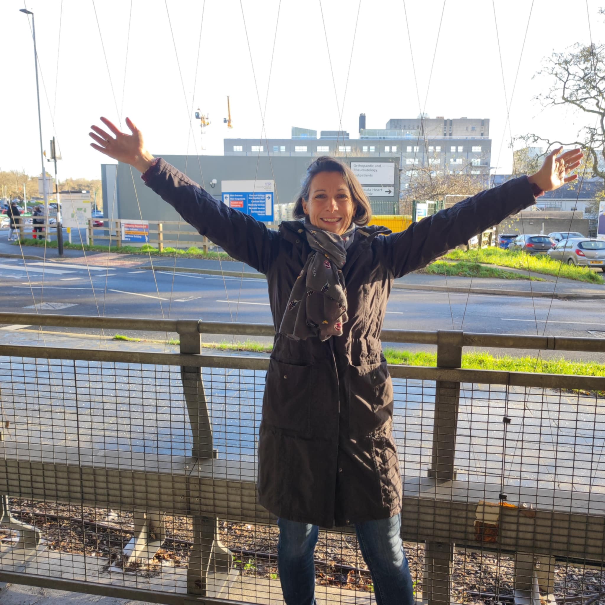 Lisa celebrating outside hospital after being discharged