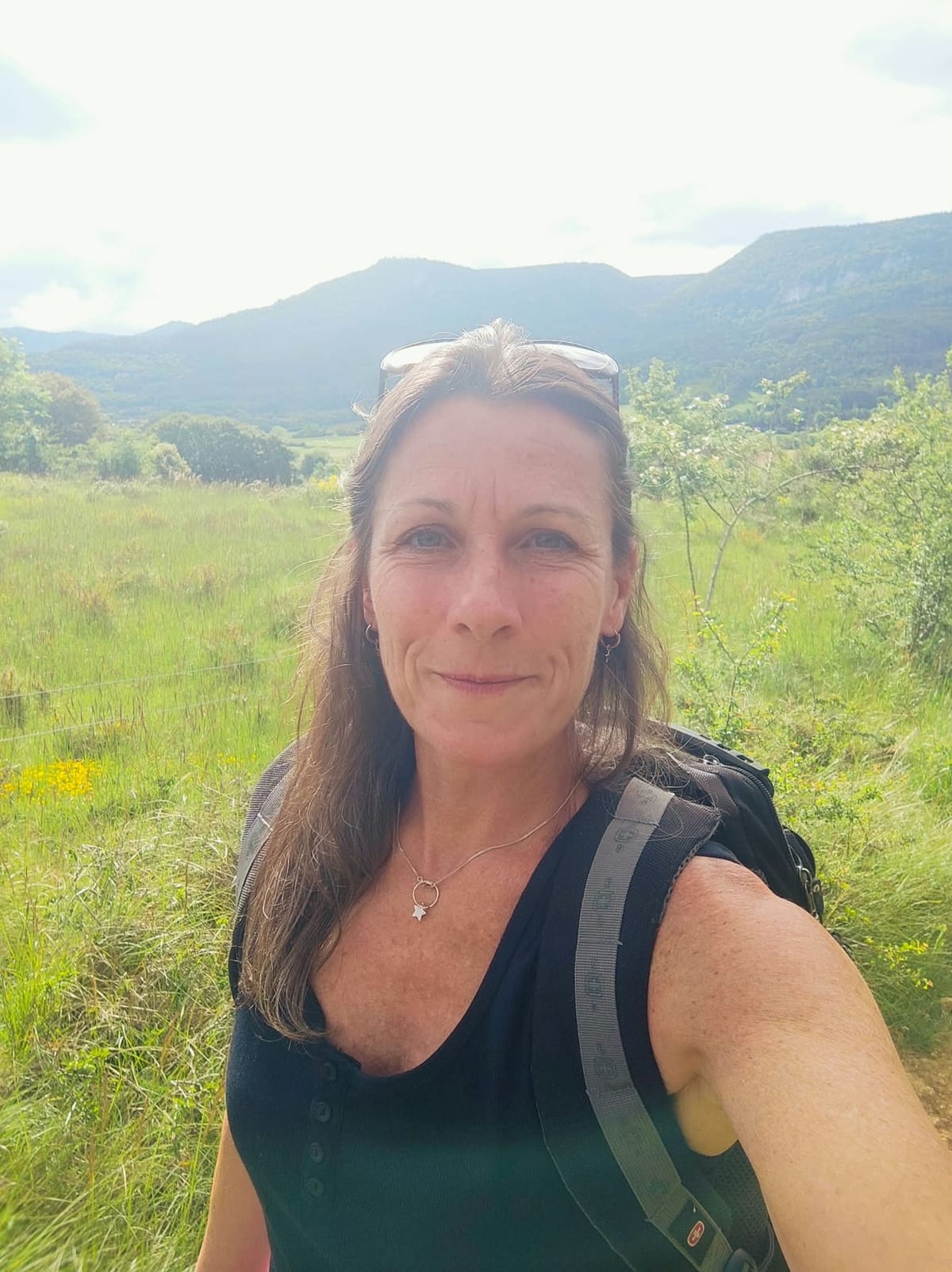 Lisa Picton smiling on a mountain walk